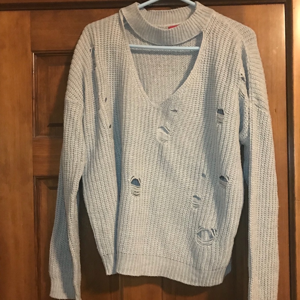Buckle distressed sweater